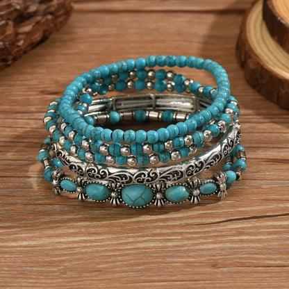 SET DI BRACCIALI BOHO CON PERLINE TURCHESI